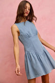 Light blue denim sleeveless mini dress with fitted bodice and flared skirt.