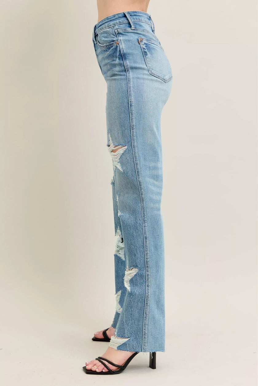 90s rigid distressed denim jeans, high-waisted straight fit, faded light blue, frayed leg details