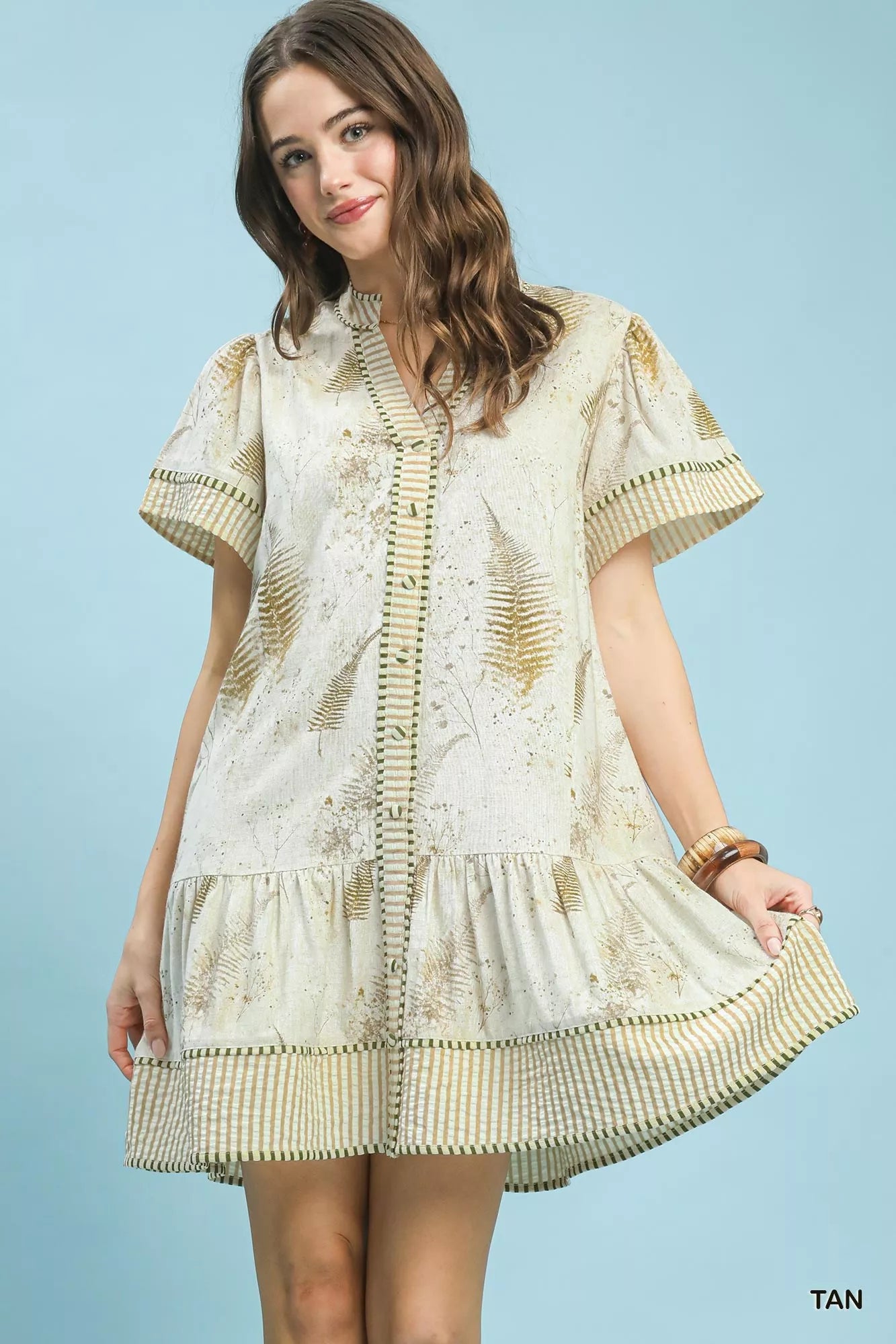 Tan linen dress with gold fern print and ruffled tiered hem featuring button front and side pockets