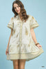 Tan linen dress with gold fern print and ruffled tiered hem featuring button front and side pockets