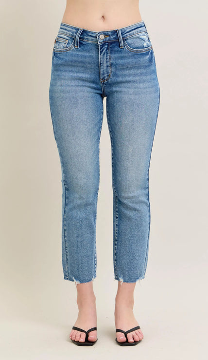 Light blue vintage wash denim jeans with distressed hem and kick flare fit