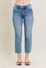 Light blue vintage wash denim jeans with distressed hem and kick flare fit