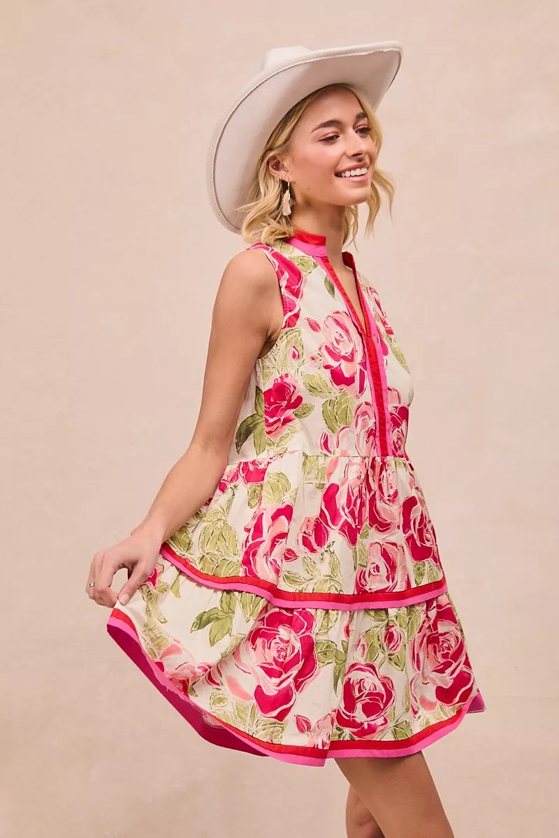 Side profile of floral mini dress showcasing tiered ruffle detail