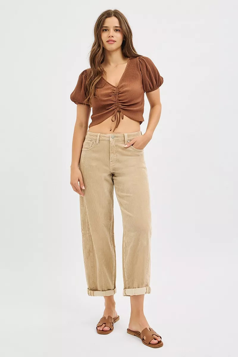 Detail of corduroy pants showing waistband and rise