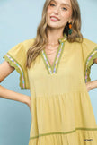Lemon yellow linen dress with floral trim and tiered flutter sleeves