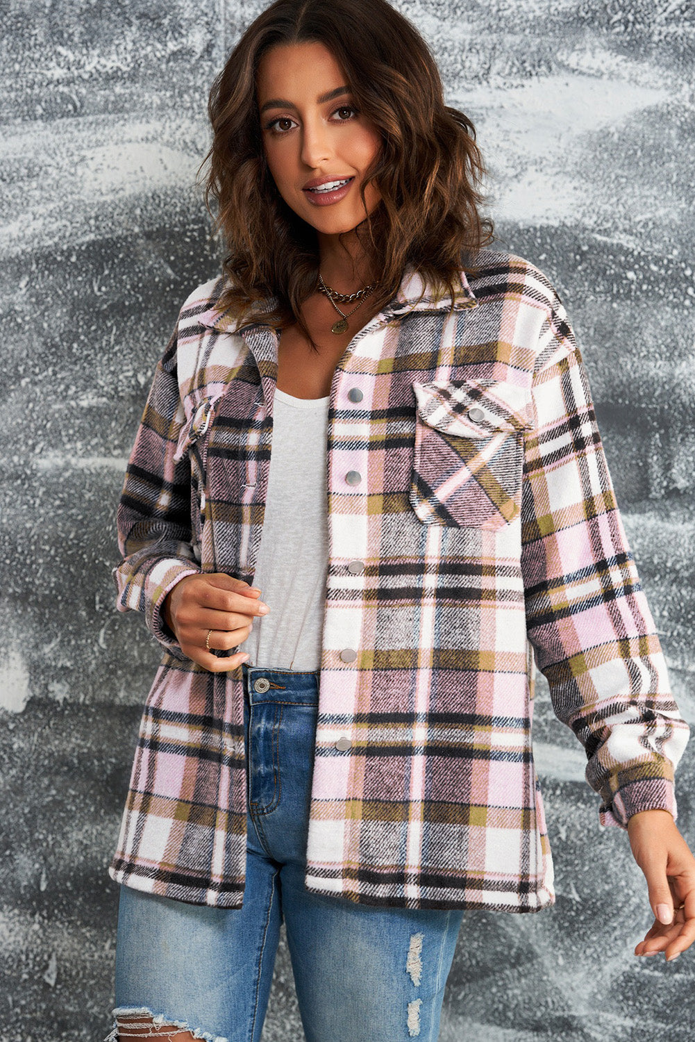 Plaid button-front shirt jacket styled with cuffed sleeves and collar detail