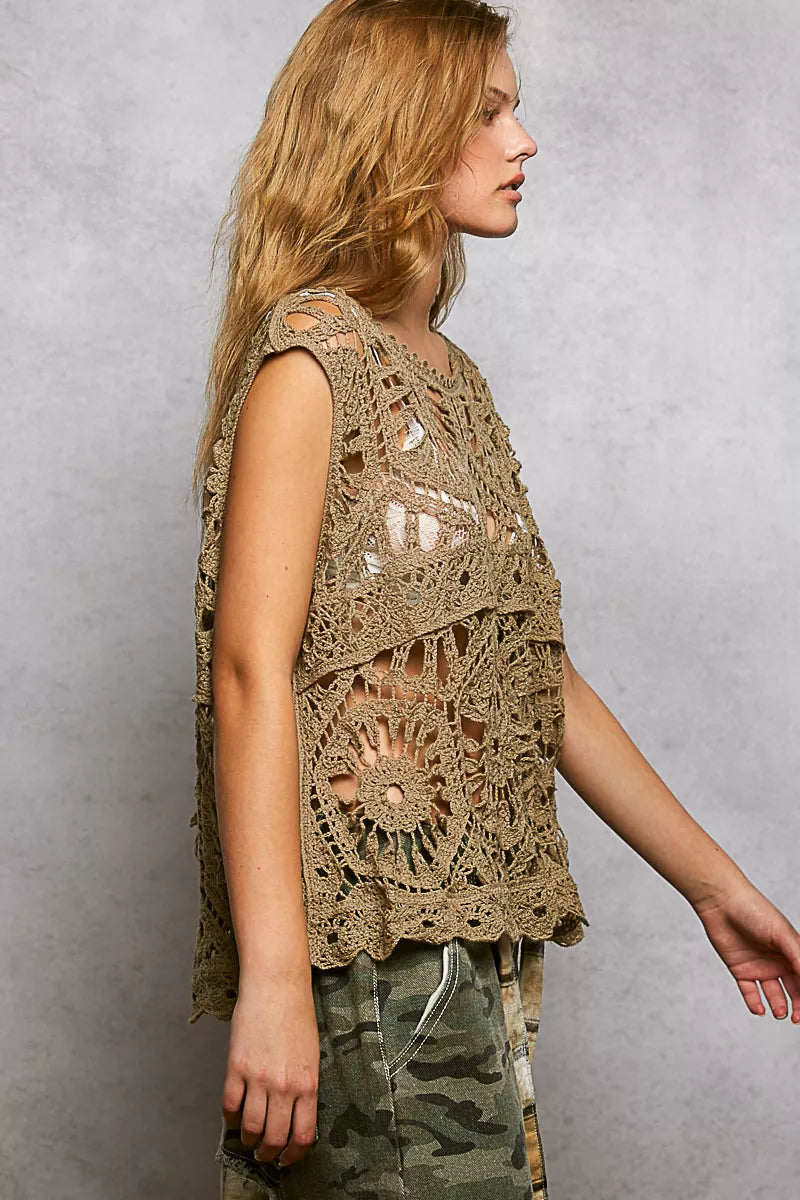 Sleeveless crochet tank showcasing airy openwork floral design