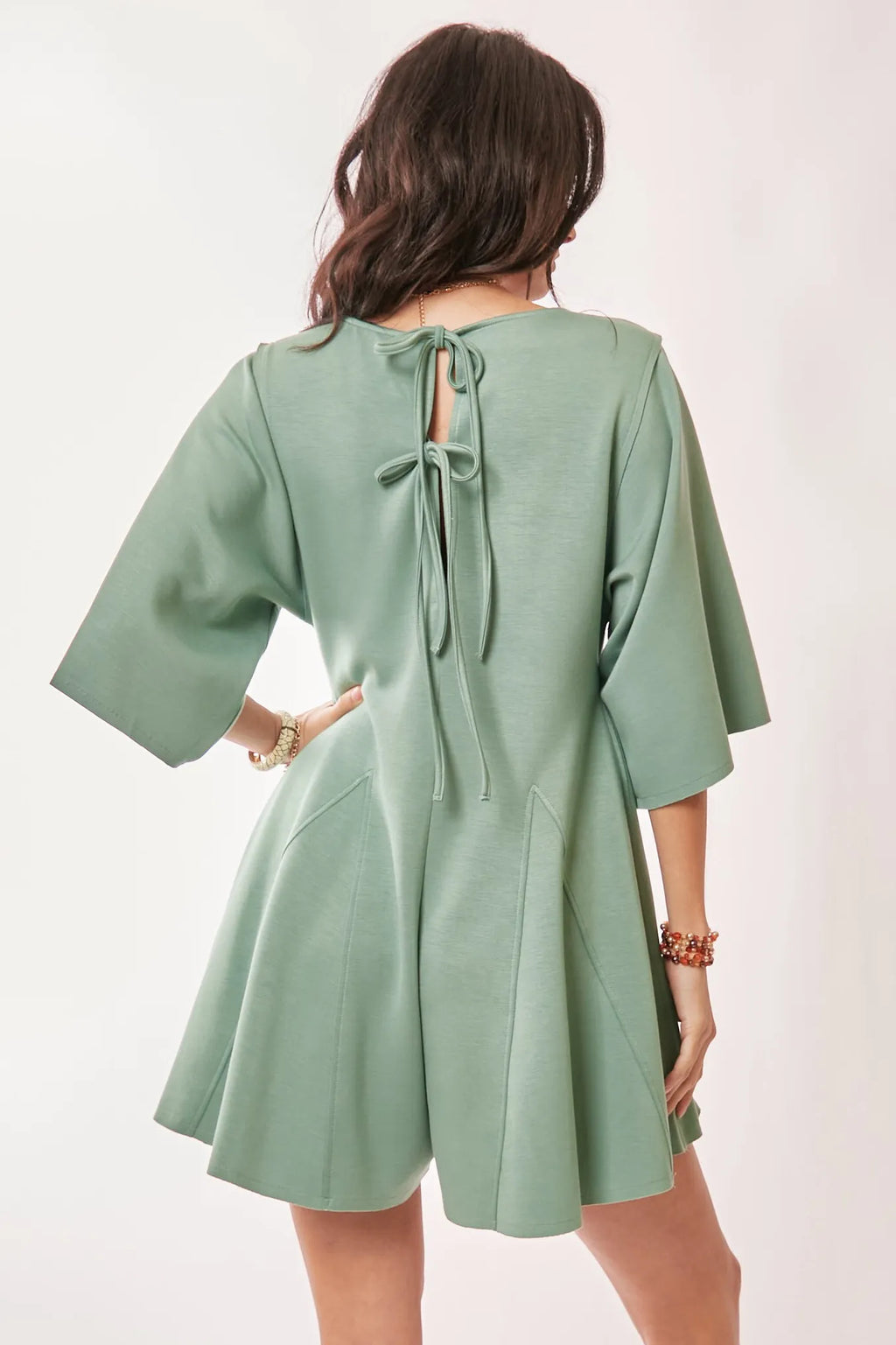 Tied-back romper with wide sleeves and relaxed fit for casual wear