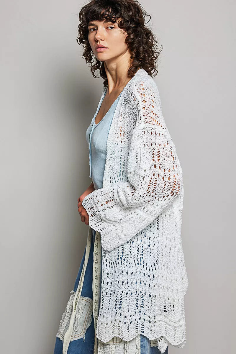 White openwork cardigan with scalloped hem, lightweight knit, loose fit, sheer texture