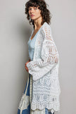 White openwork cardigan with scalloped hem, lightweight knit, loose fit, sheer texture