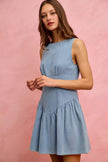 Light blue denim sleeveless mini dress with flared skirt and fitted waist.