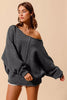 Charcoal grey slouchy boucle sweater with exposed seam details