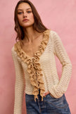 Cream pointelle knit cardigan with beige ruffle front and relaxed fit