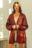 Shimmering red metallic knit V-neck cardigan with loose fit and textured open front