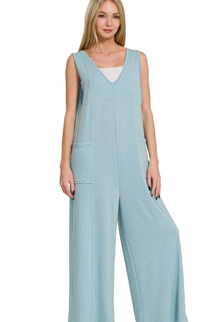 Close-up of pocketed French terry jumpsuit in dusty teal