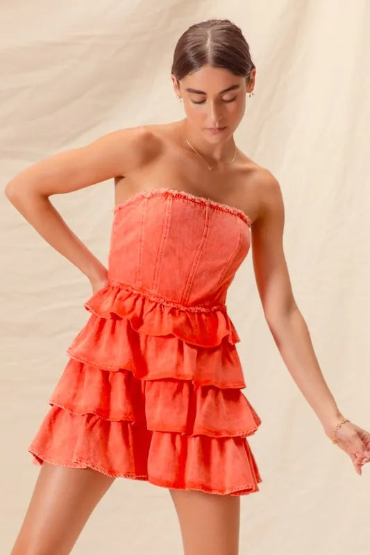 Close-up of ruffled mini dress in burnt orange
