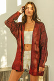 Red metallic knit v-neck cardigan with loose fit and shimmering texture