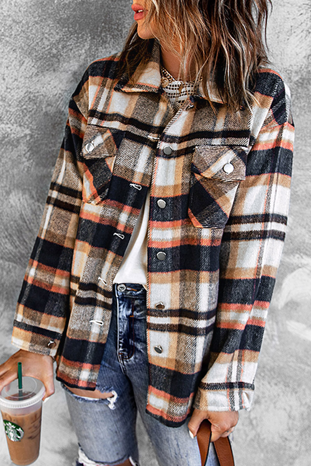 Plaid shirt jacket paired with layered outfit, front button closure visible