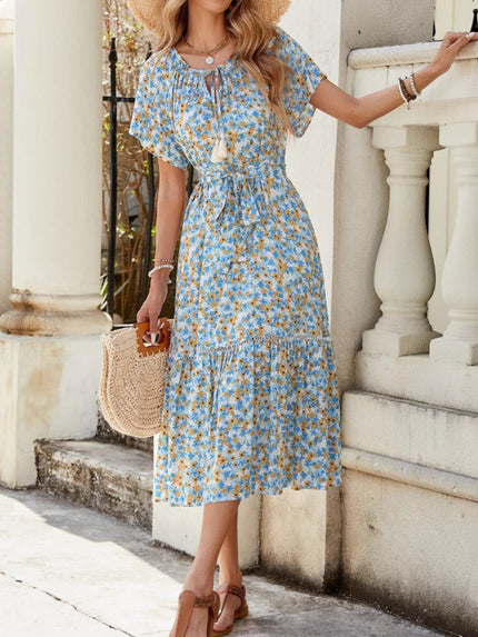 Blue floral ruffle hem midi dress with tie front and short sleeves.
