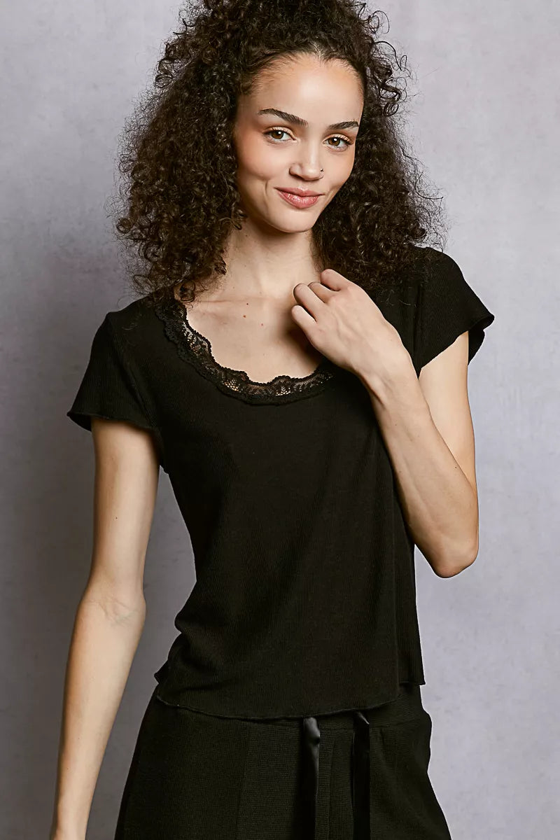 Close-up of lace detailing on short sleeve top