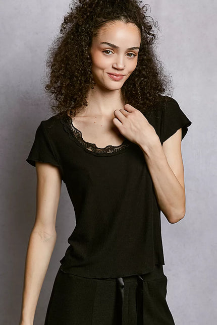 Close-up of lace detailing on short sleeve top
