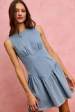 Light blue denim mini dress with fitted bodice and flared skirt.