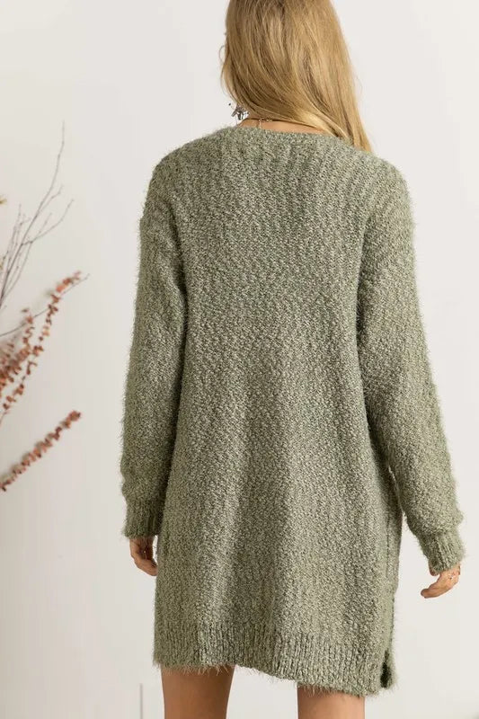 Relaxed fit olive green cardigan worn over light top