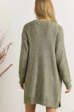 Relaxed fit olive green cardigan worn over light top