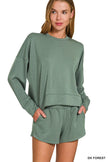Close-up of pocketed scuba sweatshirt with matching forest green shorts