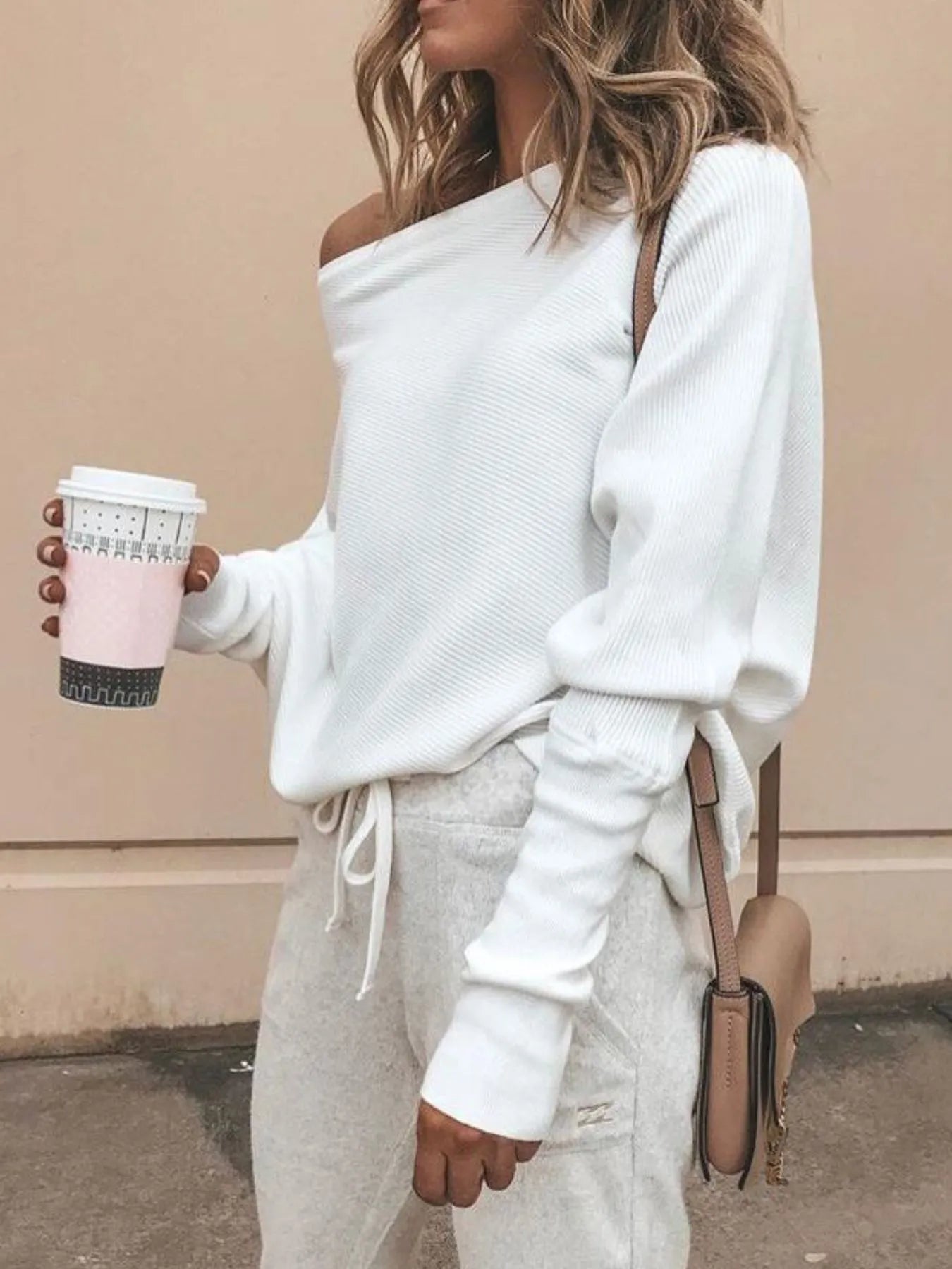 Lightly textured ribbed knit top with draped oversized fit