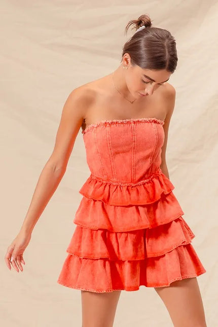 Close-up of ruffled bodice on strapless mini dress