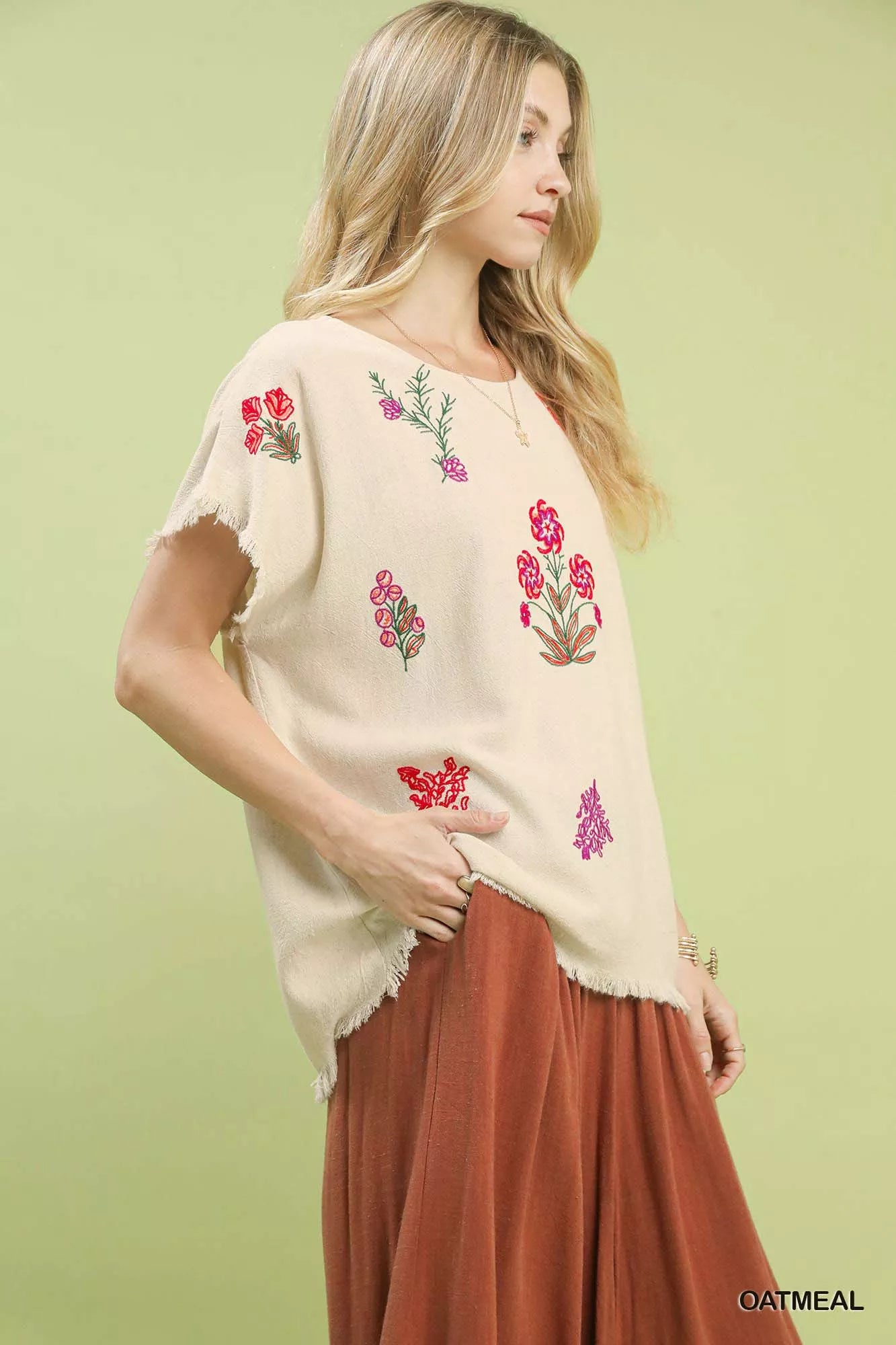 Close-up of floral embroidery on breathable linen-blend top