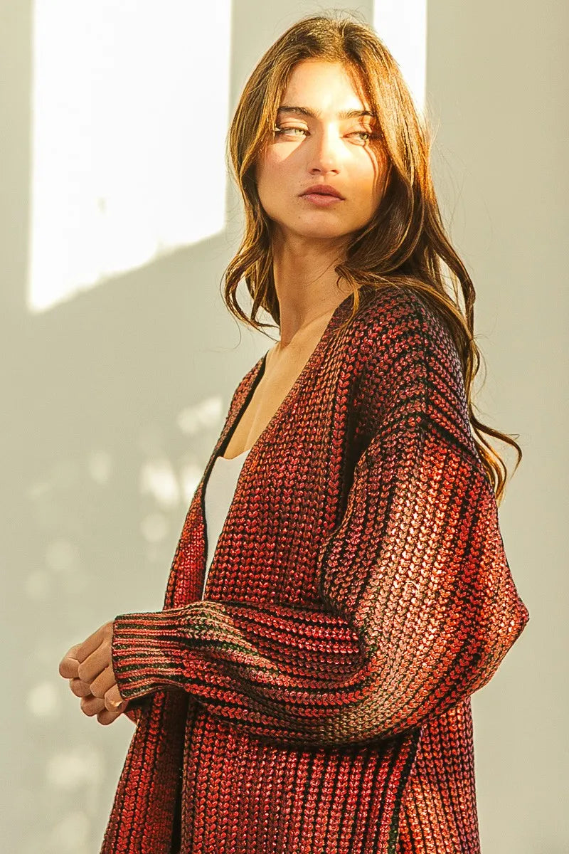 Shimmering red metallic knit V-neck cardigan with loose fit and textured open front
