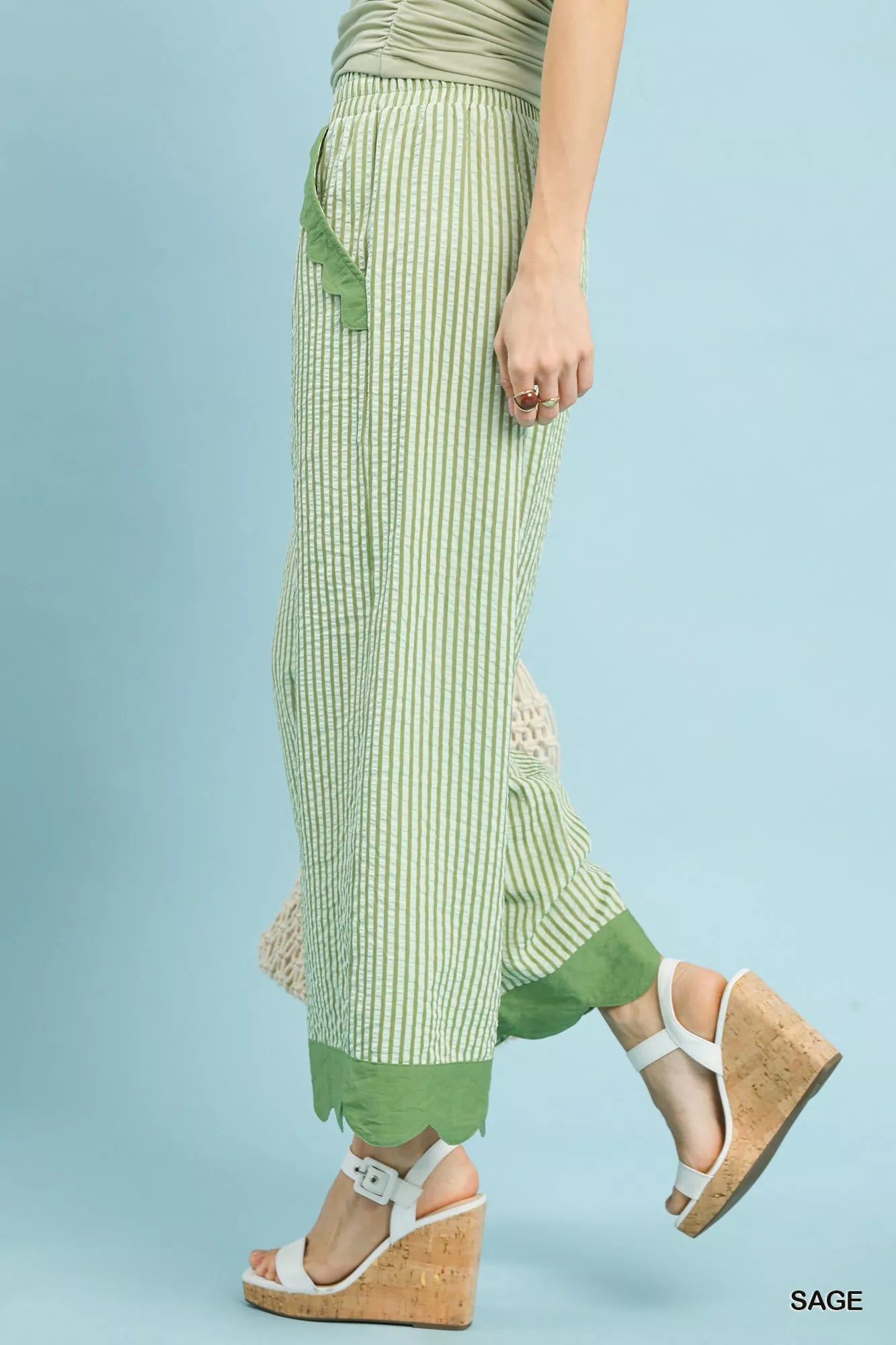 Close-up of scalloped hem on lightweight wide-leg pants