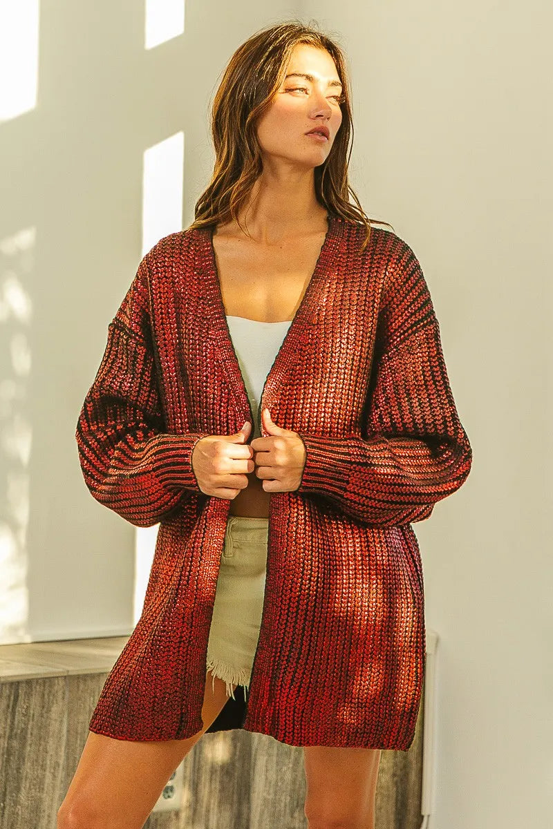 Red metallic knit V-neck cardigan, shimmering texture, loose fit, open front.