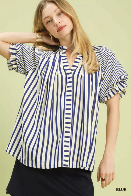 Close-up of vertical stripes on lightweight polyester top