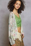 Lightweight knit cardigan showcasing floral print and fringe