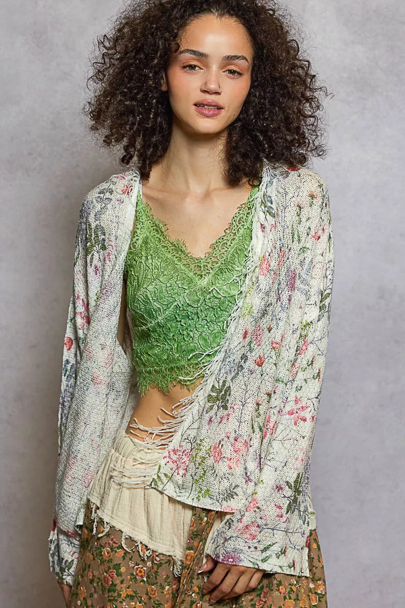 Relaxed fit floral cardigan with open front and fringe edges