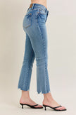 Light blue vintage wash denim jeans with frayed hem and kick flare fit