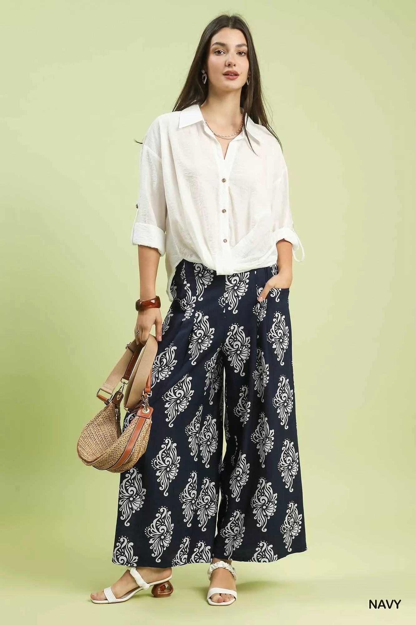 Close-up of navy abstract print on wide-leg pants fabric