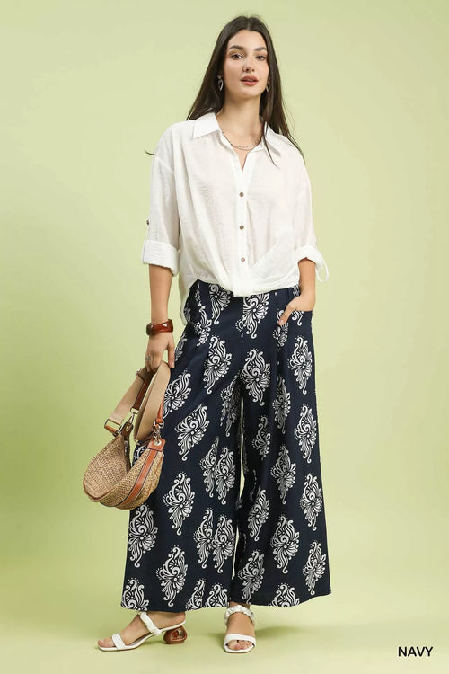 Close-up of navy abstract print on wide-leg pants fabric