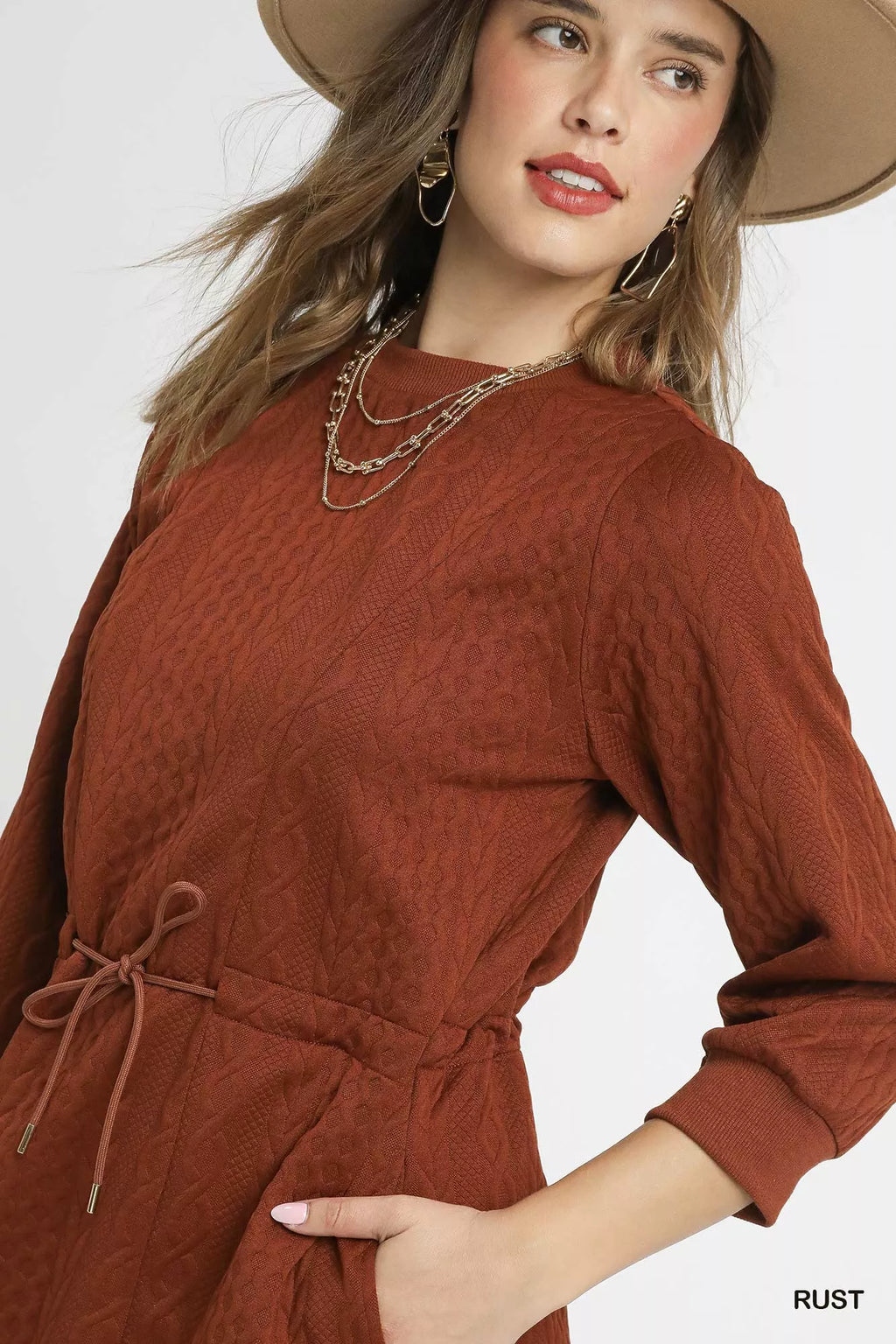 Soft cable-knit texture on rust orange mini dress with drawstring
