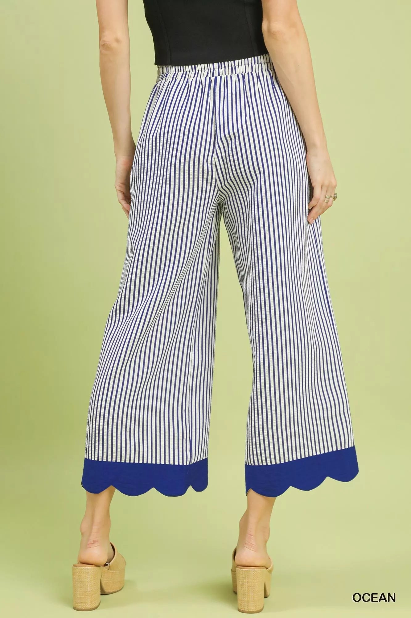 Wide-leg pants showcasing vertical pinstripe pattern