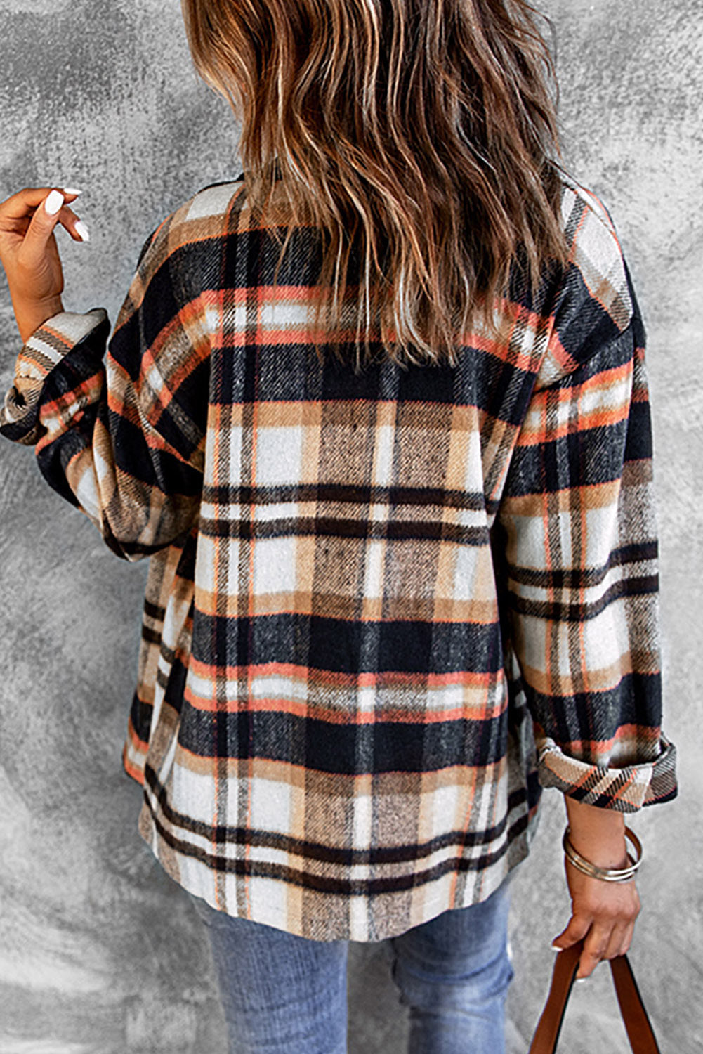 Side angle of classic plaid button-front shirt jacket with long sleeves