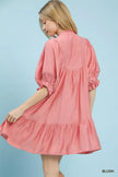 Boho pink smocked bib ruffle babydoll dress with flowy layers and soft feminine fabric.