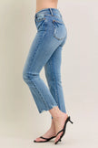 Light blue vintage wash denim jeans with distressed hem and kick flare fit