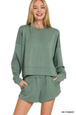Deep forest green scuba sweatshirt and shorts set displayed on model