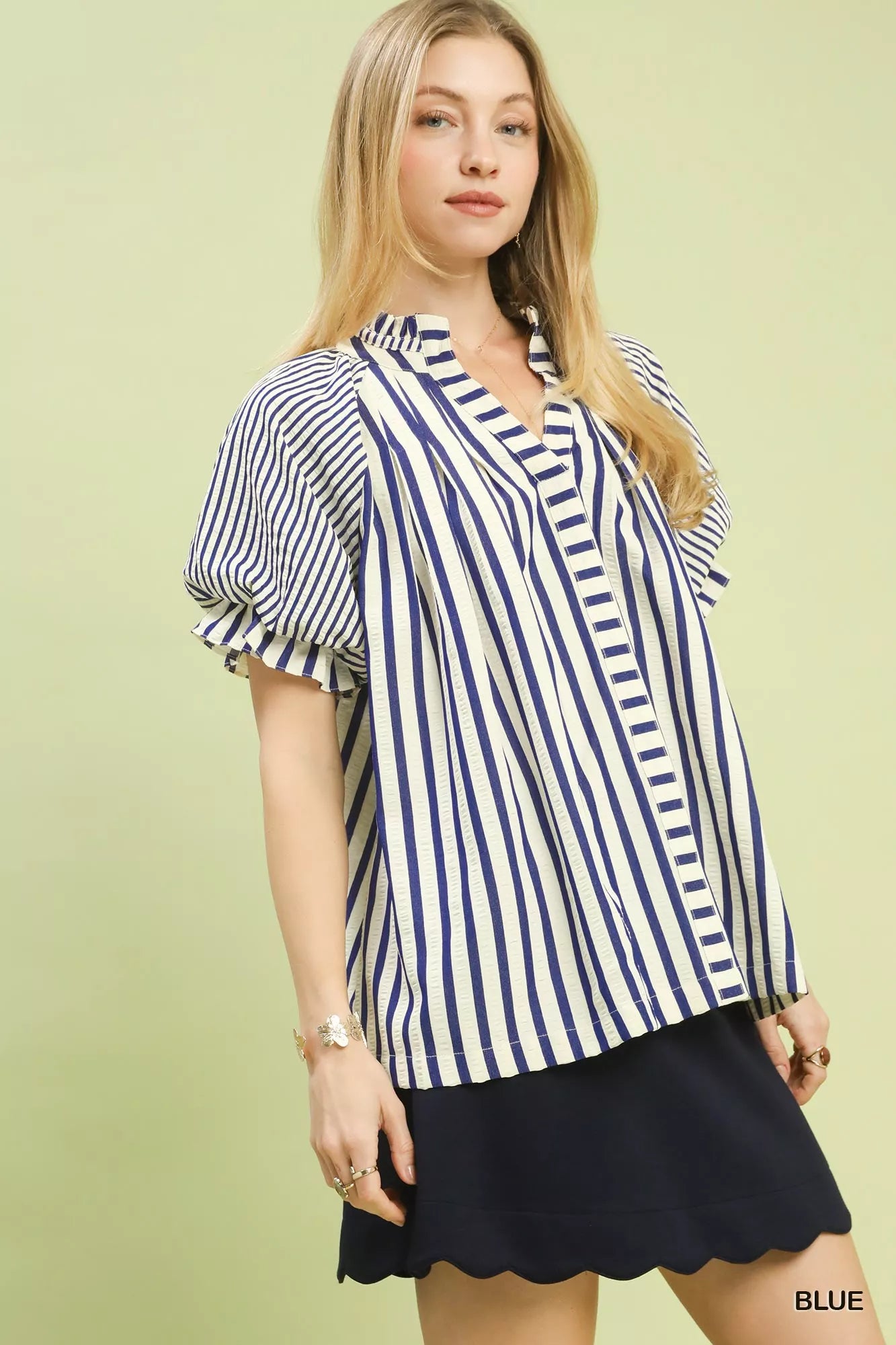 Front view of lightweight striped top with notched neck