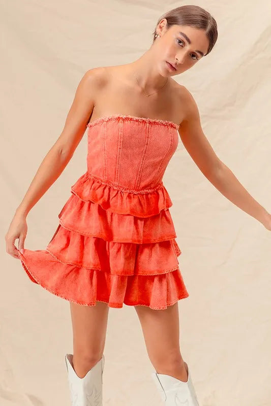 Flirty ruffle accents on strapless layered dress