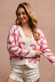 Pink and white textured heart patterned buttoned v neck cardigan with relaxed fit